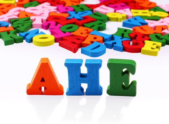 AHE Letters Spelled out using children's alphabet blocks